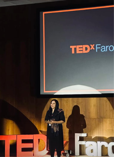 Henna Ayoob speaking at TEDx Farook College